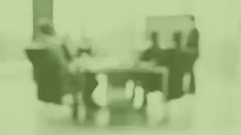 employees seated at conference table